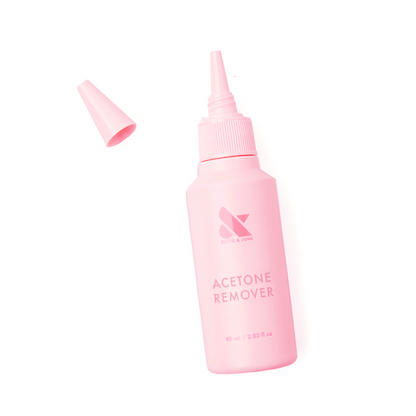 Pink squeeze bottle of Olive and June Acetone Remover for easy at-home mani and gel polish removal