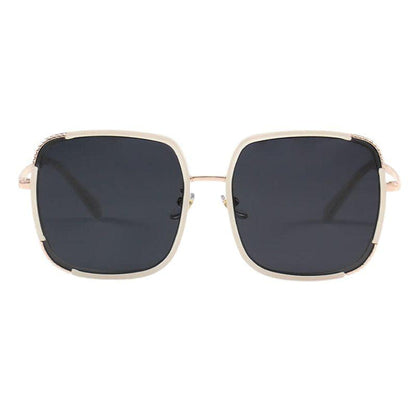 Amalfi  Quartz sunglasses from EyeCandys, showcasing a chic summer look with purple tinted lenses and a sleek frame
