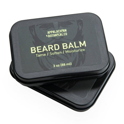 Men's grooming beard balm by Appalachian Botanical Co., natural styling product in a metal tin with a smooth balm texture.