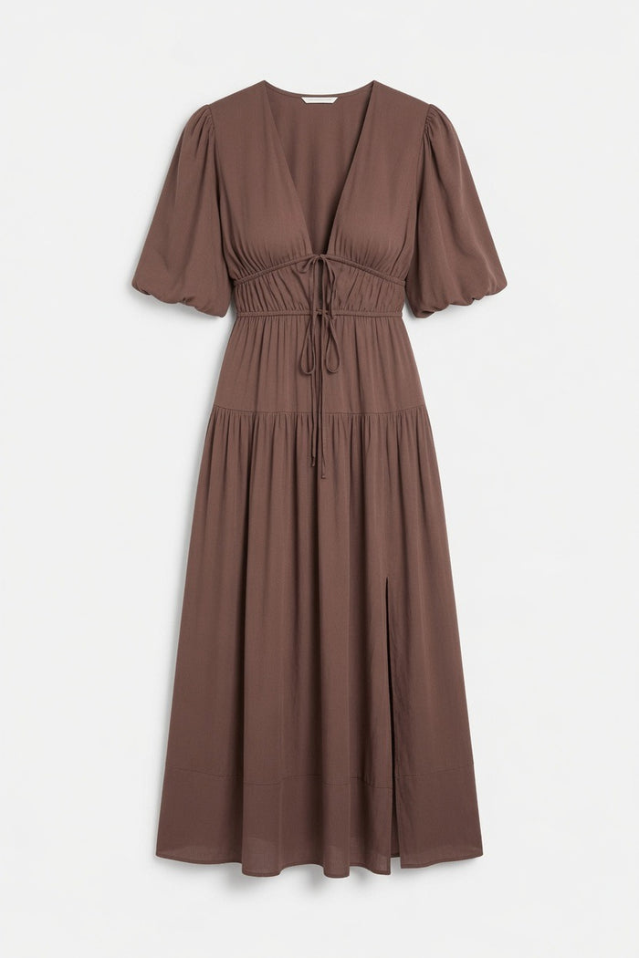 A brown midi-length dress with short puff sleeves, a V-neckline, and a drawstring waist, shown against a plain light gray background.