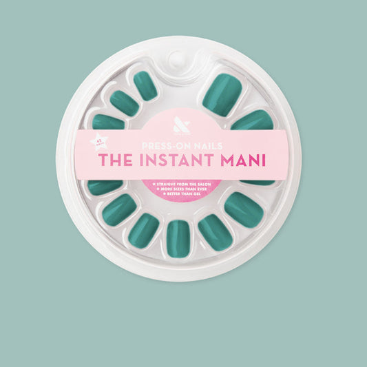 Pack of Besties - Press-On | Short | Squoval deep emerald green false nails in round white packaging on light teal background
