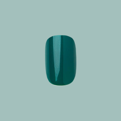 Besties - Press-On | Short | Squoval single deep emerald green short squoval false nail on muted teal background