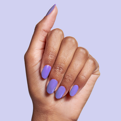 Hand with nails polished in Bold & Unshaken purple gel polish for a vibrant, long-lasting manicure by Olive and June