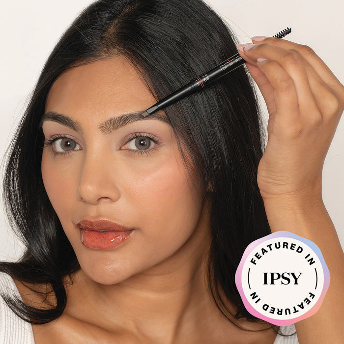 Woman applying makeup with a brush, featuring IPSY logo