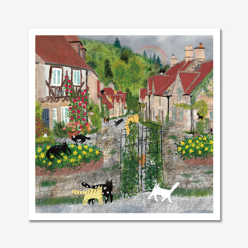 Unframed art print of black and white cats in bright flower-filled village scene