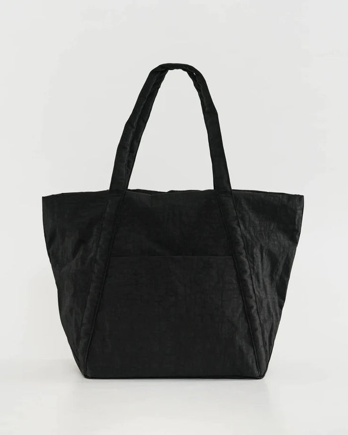 Cloud bag tote in black with two top handles and a wide open main compartment.