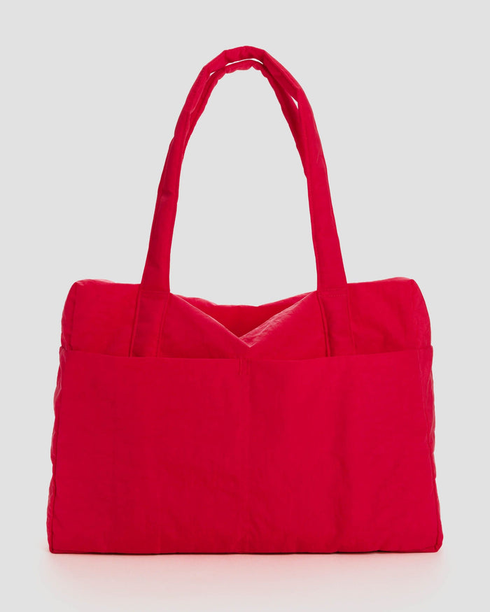 Carry-on travel bag in bright red with short top handles and padded base.