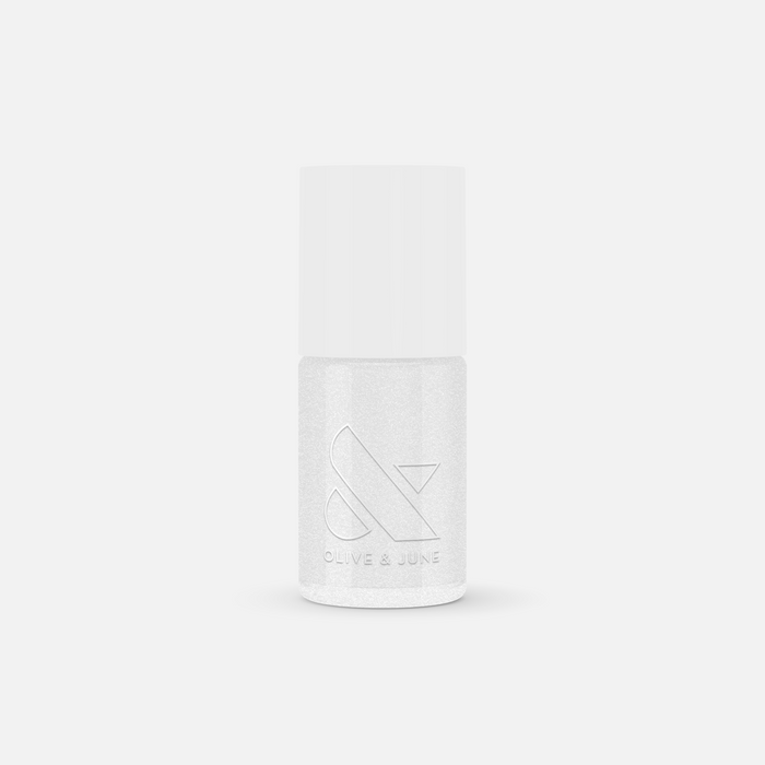 Bottle of COSMIC shimmer clear nail polish by Olive and June with a subtle sparkling finish for mani or pedi use