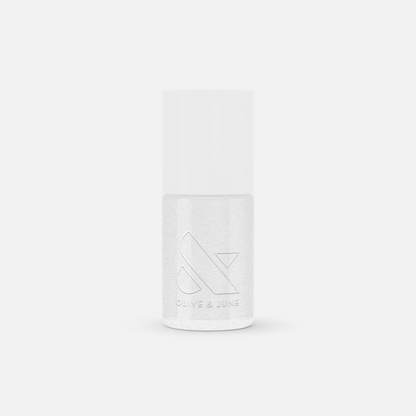 Bottle of COSMIC shimmer clear nail polish by Olive and June with a subtle sparkling finish for mani or pedi use