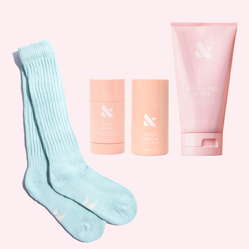 Cuddle Up Kit featuring soft socks, heel balm, foot serum, and mani + pedi scrub for hydrated feet care