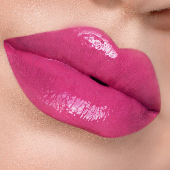 Dream Up magenta pink lipstick on lips, light skin tone close-up