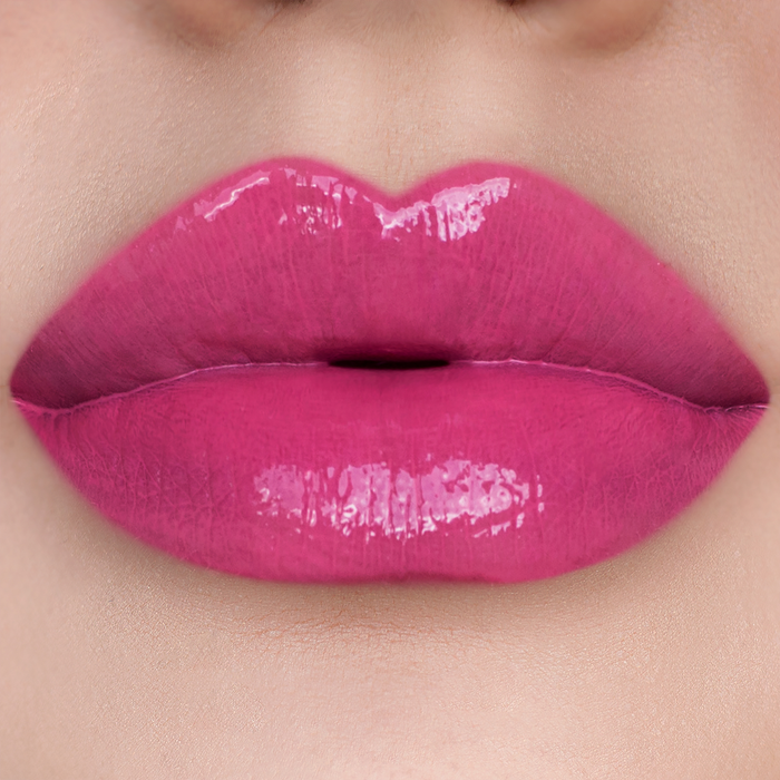 Dream Up magenta pink lipstick on lips, light skin tone