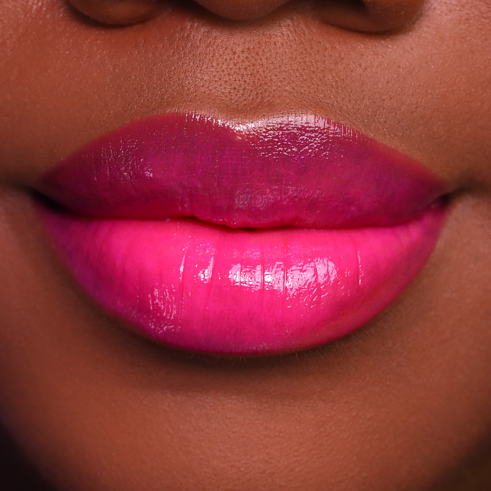 Dream Up magenta pink lipstick on lips, medium-deep skin tone