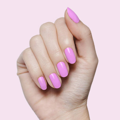 Hand with nails painted in Fierce & Loving lilac gel polish for a smooth, long-lasting manicure by Olive and June