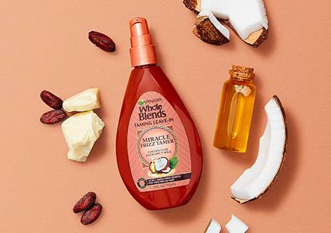 GARNIER whole blends taming leave in miracle frizz tamer coconut oil cocoa butter ￼