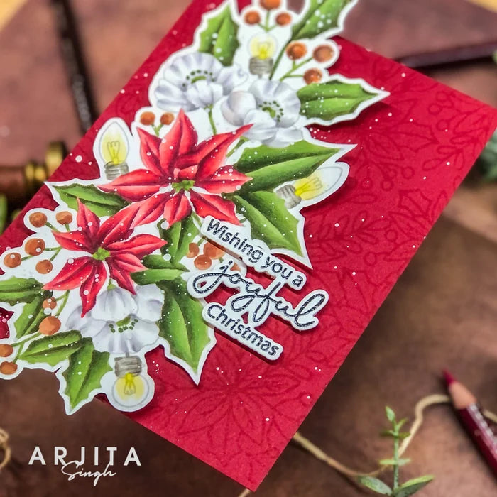Gina K. Designs - Stamp &amp; Die Set - Joyful Season. Joyful Season is a stamp set by Arjita Singh. This set is made of premium clear photopolymer and measures 6" X 8". Made in the USA. Available at Embellish Away located in Bowmanville Ontario Canada. Card example by Arjita Singh.