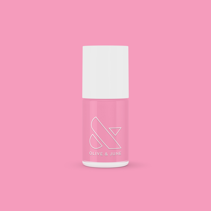 Bottle of Grateful & Kind pure pink gel polish by Olive and June for long-lasting at-home manicures