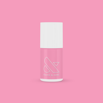 Bottle of Grateful & Kind pure pink gel polish by Olive and June for long-lasting at-home manicures