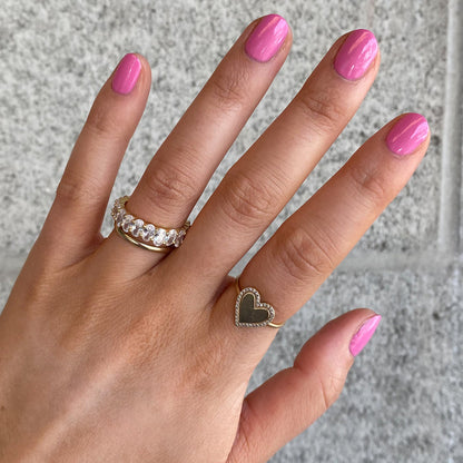 Hand with nails painted in Grateful & Kind pink gel polish showing a shiny, long-lasting manicure by Olive and June