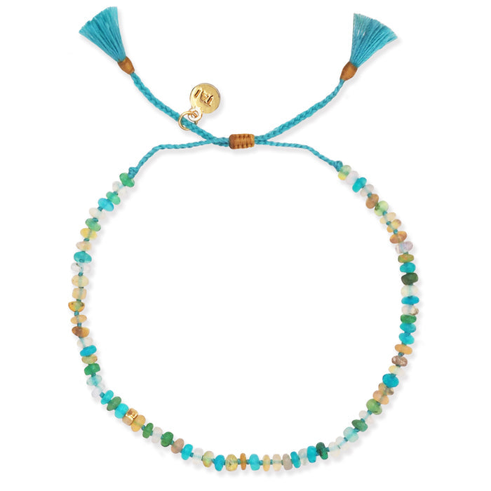 Turquoise cord multistone bracelet with heart toggle charm and tassel ends