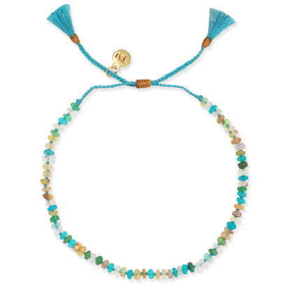 Turquoise cord multistone bracelet with heart toggle charm and tassel ends