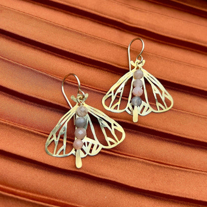 Handmade Peppered Moth earrings by Fluff Hardware showing detailed black and white moth design on silver hooks.