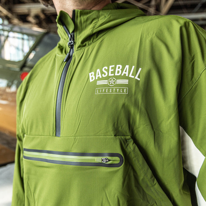 Adult model wearing green Heritage Windbreaker Unit 101 windbreaker
