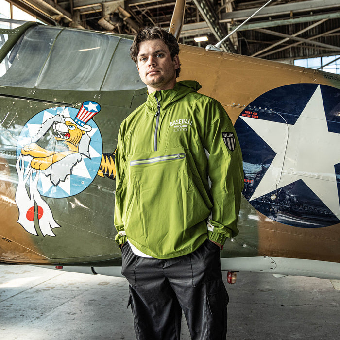 Adult model wearing green Heritage Windbreaker Unit 101 windbreaker