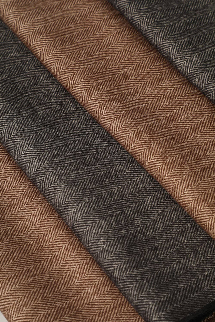 Fashion City herringbone muffler scarf with stylish pattern, soft fabric, perfect for cold weather and layered winter outfits.
