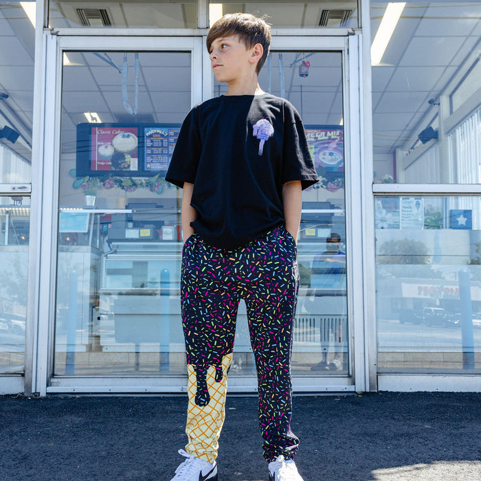 Youth model wearing ice Cream Pajama Pants Midnight Sundae youth pants