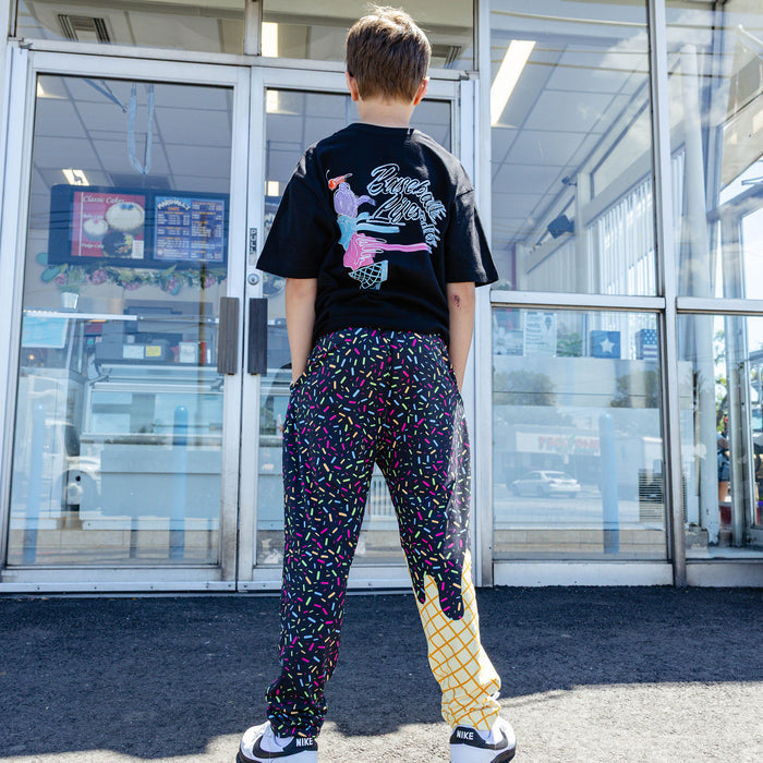 Youth model wearing ice Cream Pajama Pants Midnight Sundae youth pants