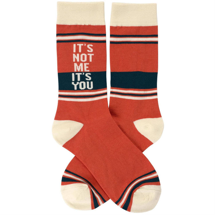 Questionables socks featuring humorous "It's Not Me It's You" design, showcasing playful socks with bold text and vibrant colors.