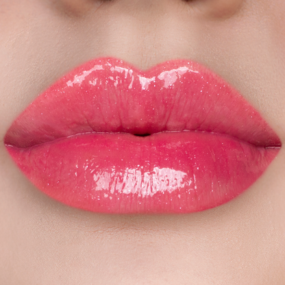 Just Cheeky berry pink lip gloss on lips, light skin tone