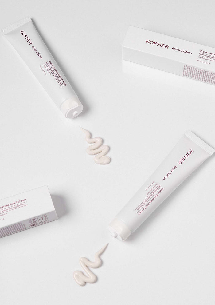 Kopher skincare products with cream on a white background