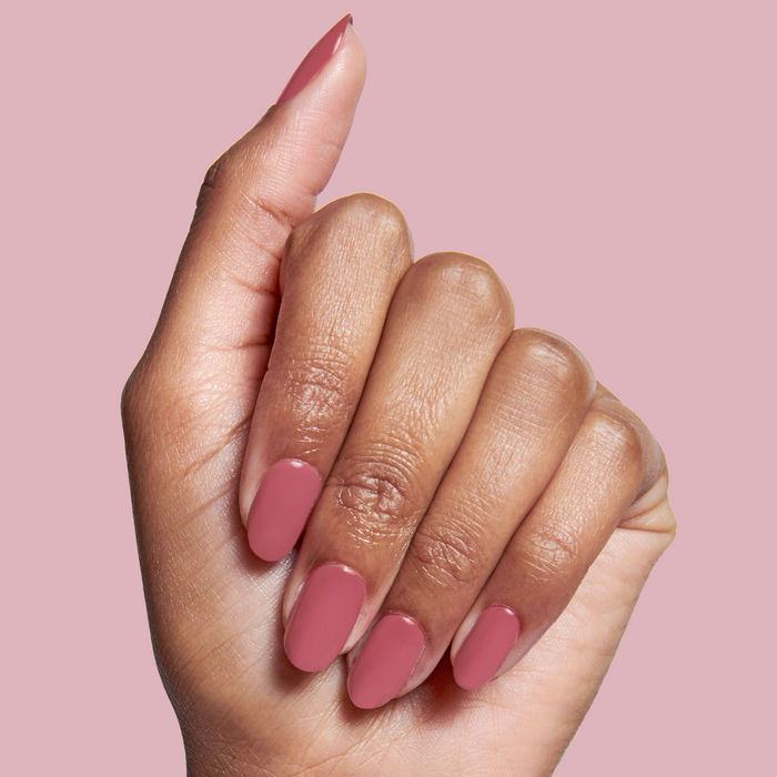 Fingernails painted with LD nail polish in a rosy rosewood shade for a natural, elegant mani look