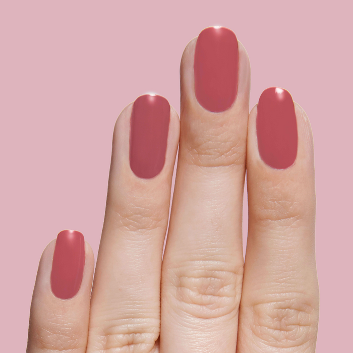 Fingernails polished in LD rosy rosewood shade for a soft, neutral manicure suitable for all seasons