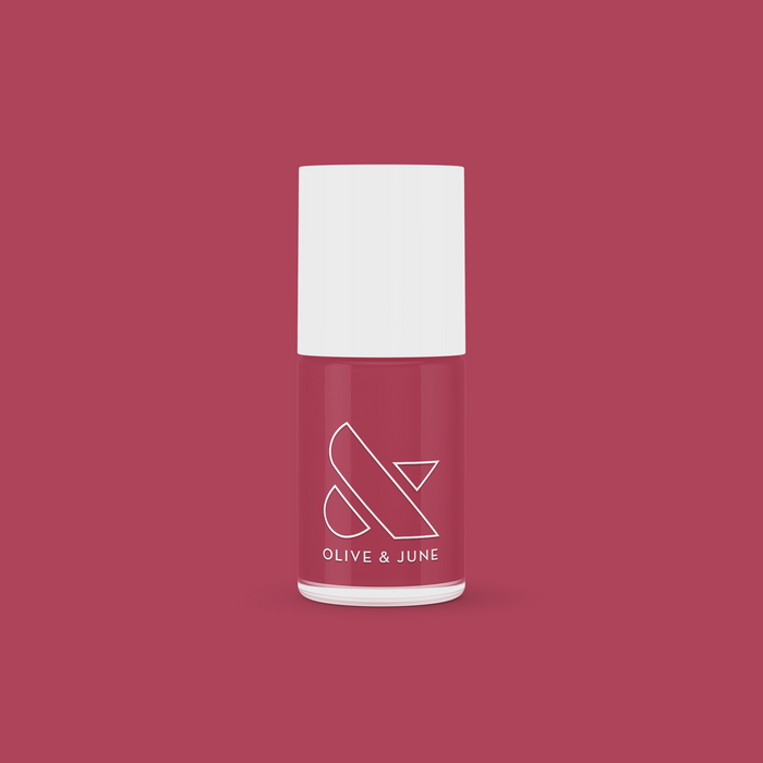 LD nail polish bottle from Olive and June in a rosy pinky rosewood shade for polished manicures at home