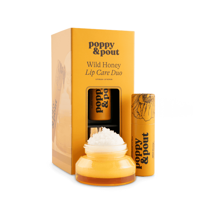 Lip care duo set with Wild Honey balm jar, lip scrub tube, and gift box