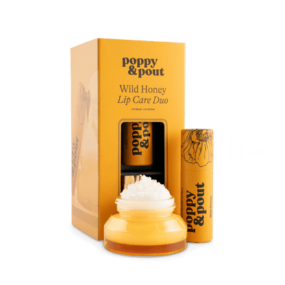 Lip care duo set with Wild Honey balm jar, lip scrub tube, and gift box