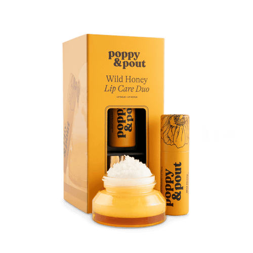 Lip care duo set with Wild Honey balm jar, lip scrub tube, and gift box