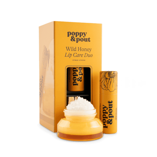 Lip care duo set with Wild Honey balm jar, lip scrub tube, and gift box
