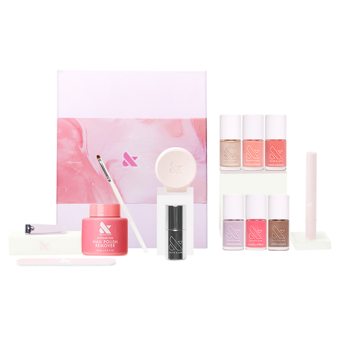 Lip Gloss System kit with six pastel-colored polishes, remover, cuticle serum, and manicure tools for at-home manicures
