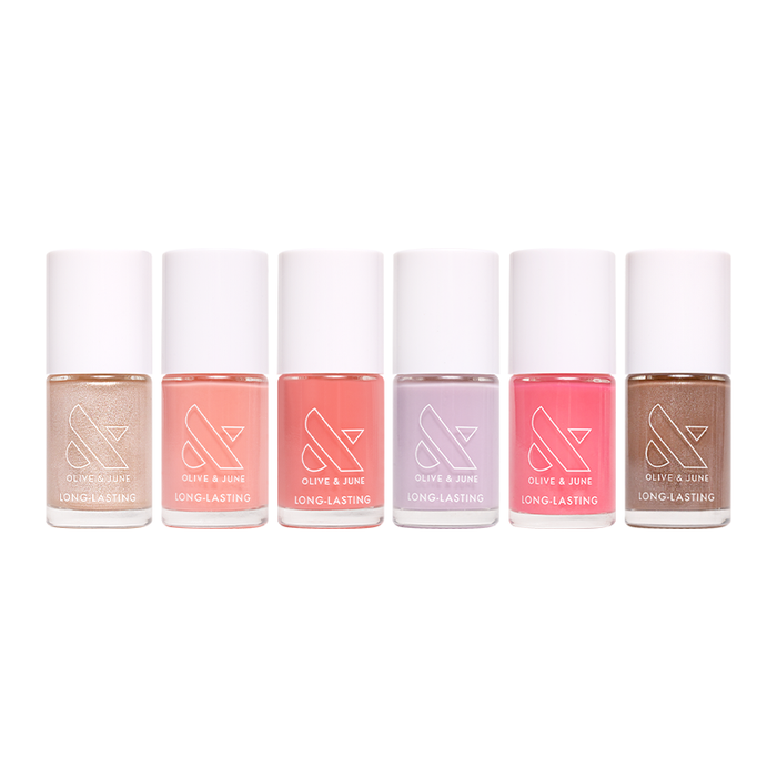Six pastel and neutral nail polishes in the Lip Gloss System by Olive and June for at-home manicures and pedicures