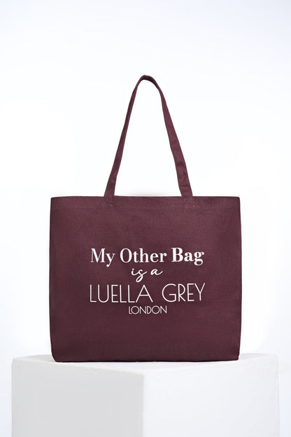 Front of Luella Cherry Canvas Shopper with printed white writing details