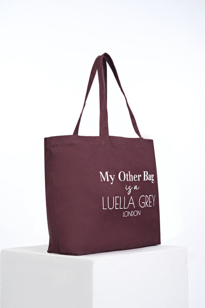Side view of Luella Cherry Canvas Shopper with printed white writing details