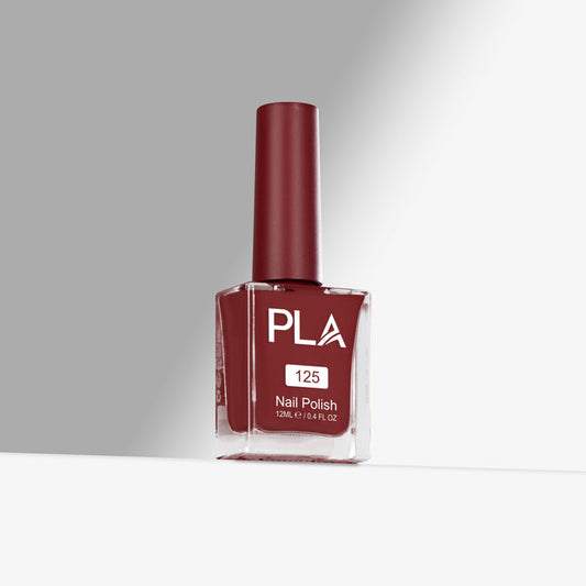 Red nail polish bottle with 'PLA' branding on a gray background