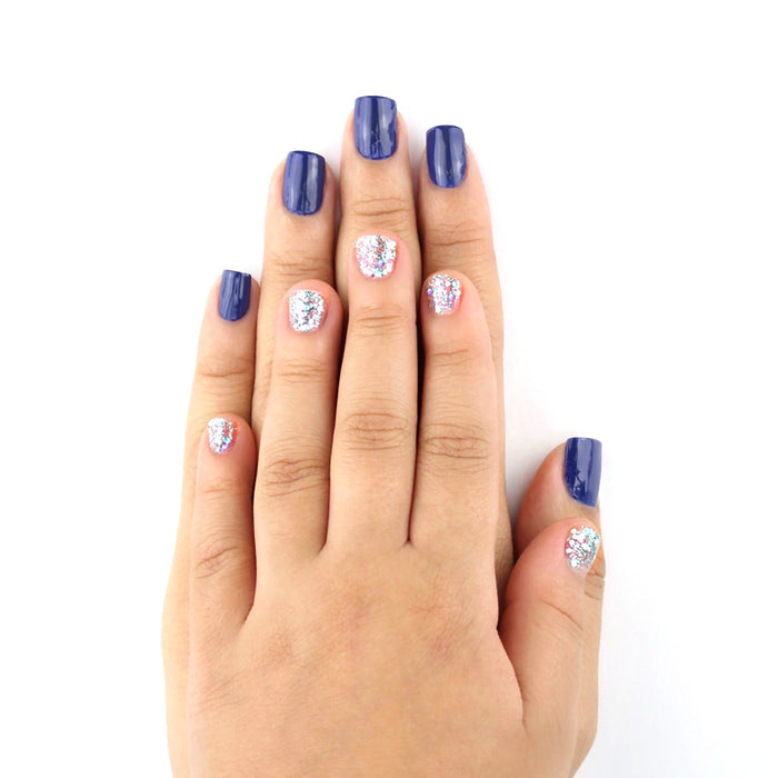 Mommy & Me Once in a Blue Luna navy nail polish with Starlight glitter accents on a child's hands