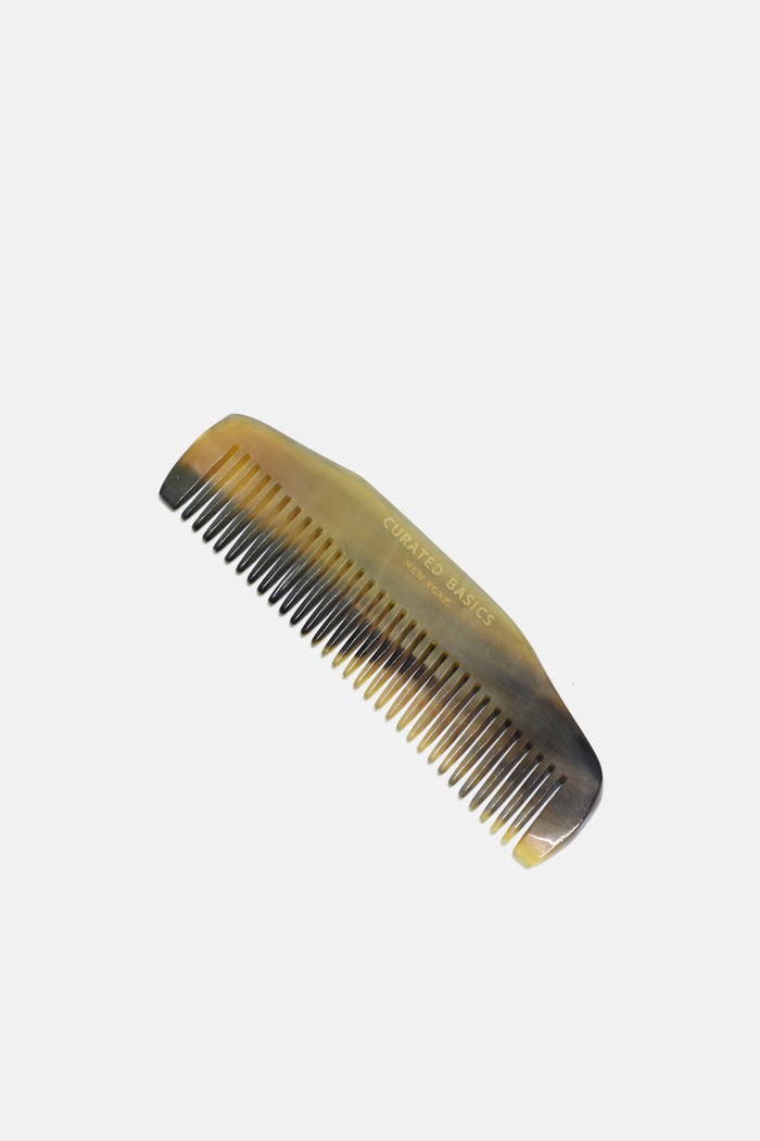 Curated Basics ox-horn comb with wide and fine teeth, natural horn material, showcasing its polished, handcrafted design.