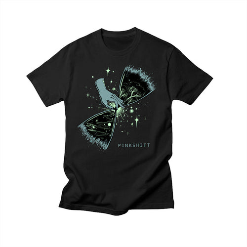 Exclusive Pinkshift design on a black Comfort Colors T-shirt shows an illustrated hand tearing open a starry sky to reveal branches and leaves. PINKSHIFT is printed beneath the artwork.