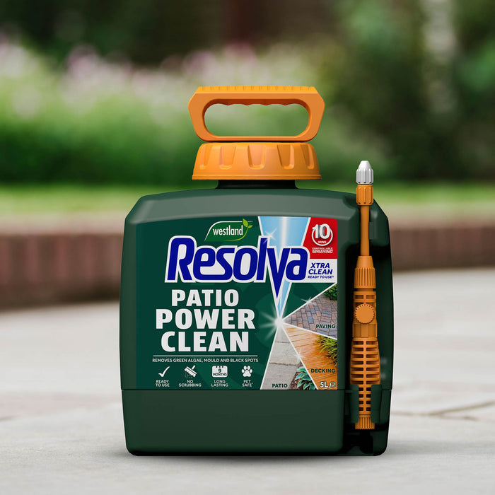 Resolva Patio Power Clean product with a brush attachment on a blurred outdoor background